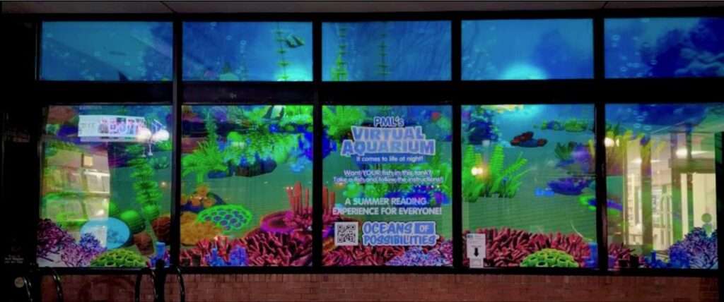 view of the librarys front window with its interactive AR aquarium on it