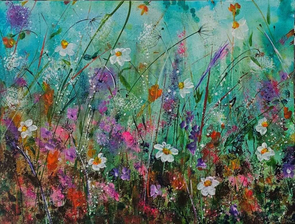 Colorful field of painterly flowers shown against a green background.