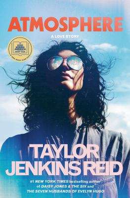 A woman with dark curly hair looking up at clear blue sky with some clouds wearing aviators as the book cover. "#1 New York Times bestselling author of Daisy Jones & the Six and the Seven husbands of Evelyn Hugo" written on the bottom.